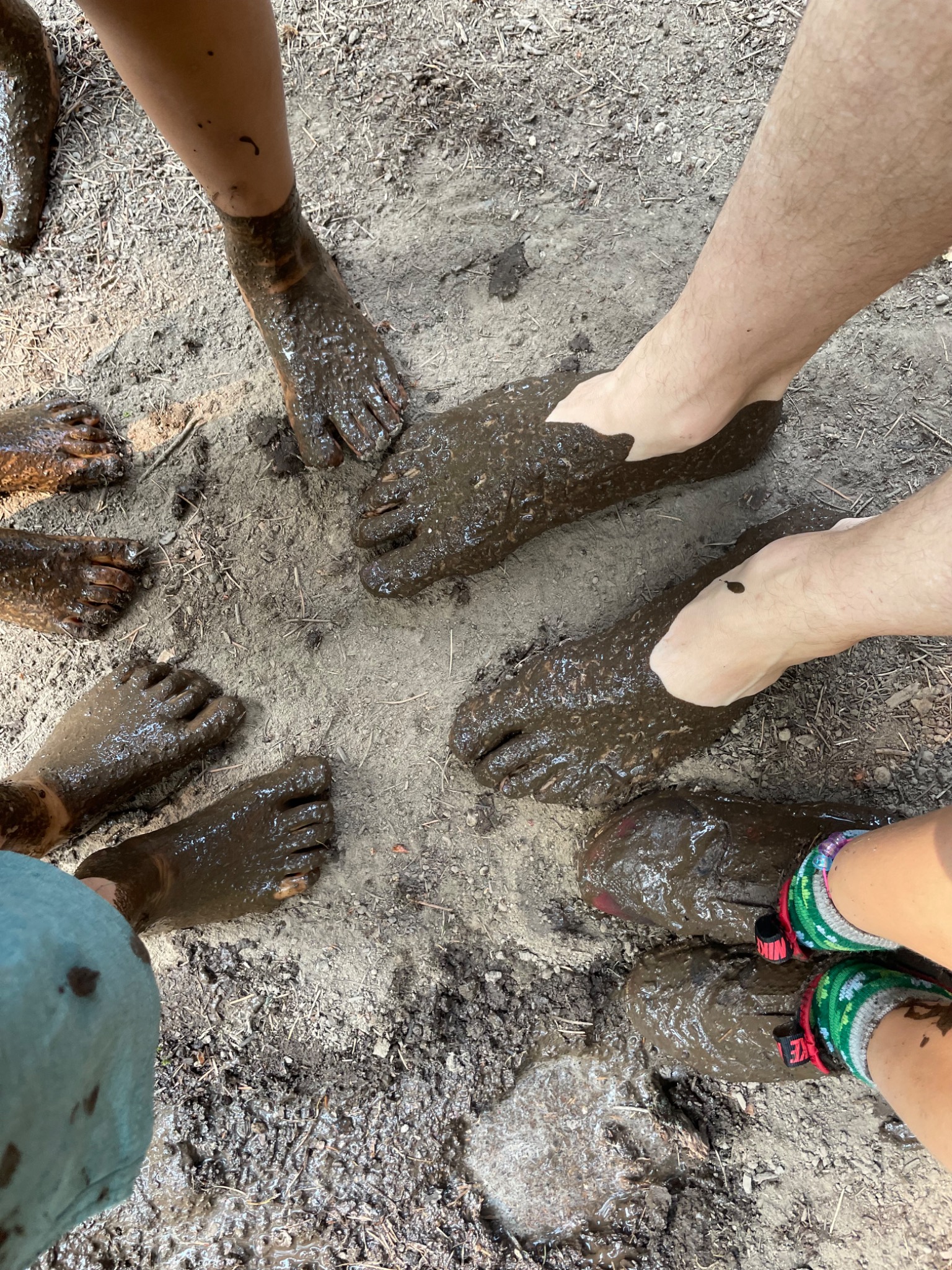 A circle of muddy feet after outdoor play